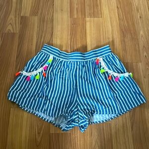 Striped shorts with colorful fringe tassel pockets